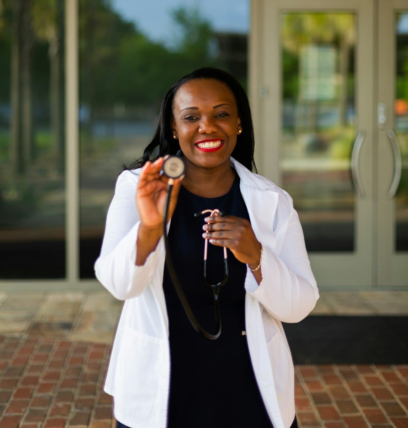 Smiling doctor holding a stethoscope