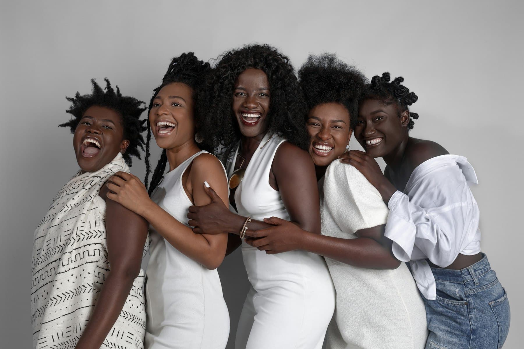 Group of women laughing and embracing